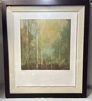 Full view of framed Kim Coulter limited edition print showing frame, mat, and artwork depicting forest scene.