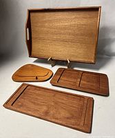 Full view of all four trays showing shapes and finishes