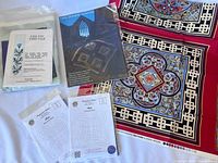 Photo showing Celtic-themed quilting patterns and beautifully printed fabric panels with intricate designs and color schemes.