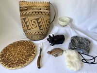 Overview showing all seven items in the lot arranged on a soft white surface.