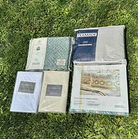 Display of all five sheet sets, showing brand packaging and patterns/colors.