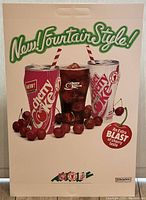 Vintage Coca-Cola Cherry Coke product advertisement poster with two cans, a glass of Cherry Coke, and cherries.