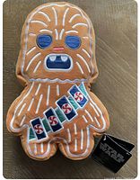 Front view of Chewbacca gingerbread style scented plush with Star Wars tag attached.