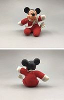Front and back views of the vintage Mickey Mouse plush toy dressed in a red and white outfit with a side tag