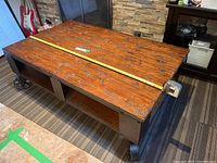Top-down front view showing full length wood plank surface with measuring tape across