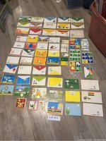 Top-down view of the full collection showing multiple envelopes, sheets, and stickers featuring colorful Peanuts character designs.