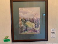 Framed watercolour painting showing full artwork with signature and frame dimensions noted