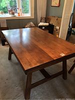 Angled top view of dining table showing wood grain and finish
