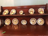 Full set displayed on hutch shelves