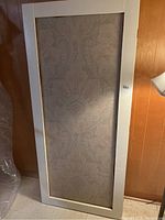 Single white framed panel showing paisley style patterned fabric insert in muted tones, likely used as a privacy screen or decorative panel.