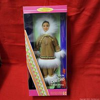 Full view of ARCTIC Barbie Doll in original box, showing doll wearing traditional Arctic costume with fur details, collecting edition branding on packaging.