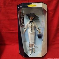 Full view of the Barbie doll in original box showing the doll standing with the text Spring in Tokyo and Barbie branding.