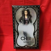Front view of sealed Barbie Collector Cher Bob Mackie doll in window display box with holographic background and Cher Bob Mackie signature