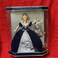 Front view of unopened boxed Barbie doll showing Millennium Princess branding and blue/silver dress.