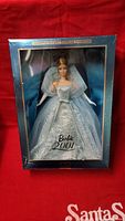 Front view of Barbie 2001 doll in original box showing light blue sparkling gown and veil with 'Barbie 2001' text on packaging.