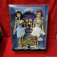 Front view of sealed box showing both dolls and Flintstones logo