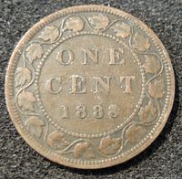 Reverse side of the 1888 Canada one cent coin displaying date, denomination and maple leaf wreath.
