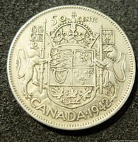 Obverse side showing 1942 Canadian coat of arms with 50 CENTS denomination