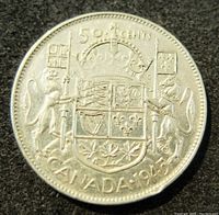 Reverse side of the coin showing the Canadian coat of arms, denomination, and year 1945.
