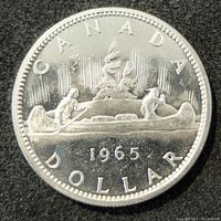 Reverse side of the 1965 silver Canada dollar depicting the canoe scene with inscriptions and date.