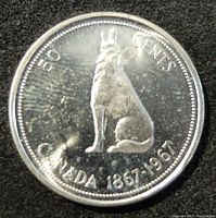 Reverse side of the coin showing a howling wolf sitting with inscriptions indicating the denomination and commemorative date.