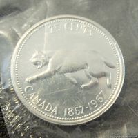Obverse side of the 1967 Canadian 25 cent coin showing the cougar and inscription 1867-1967