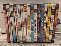 Front spines of 16 DVD movie cases standing side by side showing titles such as Bad Teacher, Bring It On, Wedding Crashers, Joe Dirt, and others.