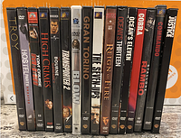 Front view of DVD cases showing all 16 movie titles in the lot.