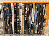 Photo of the 18 DVD spines arranged upright