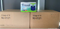 Two large cardboard boxes, each labeled for 6 bags of 16 Prevail Nu-Fit daily briefs, size medium. One bag placed on top of one box for display.