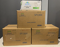 Three cardboard boxes labeled Secure SP1900 containing booster pads, with one opened pack of Secure Booster Pads Ultra 20 count 13" long shown on top for display.