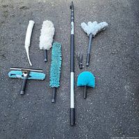 Full set of cleaning tools laid out on pavement to show all included items