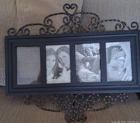 Black wrought iron multi-photo frame with glass, 4 photo slots, decorative scrolls