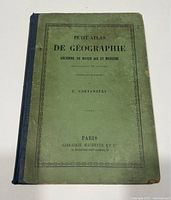 Front cover showing title Petit Atlas De Géographie Ancienne, Du Moyen Age Et Moderne by E. Cortambert, Paris Librairie Hachette et Cie.