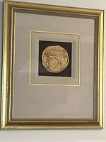 Framed Greek coin art showing full frame and matting.