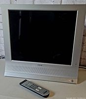 Sony CRT TV and remote control side view with TV off