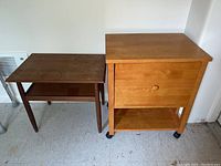 Photo showing both the rolling file cart and the side table side by side on a tiled floor against a wall.