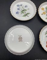 Bottom of round small plate showing Minton Meadow mark with lion and crown logo, pattern name Meadow, Bone China marking