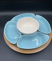 Chip and dip set arranged on a wooden lazy Susan turntable, showing the layout of the chip dishes and dip bowl.