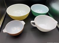 All four bowls positioned together showing color and size differences.