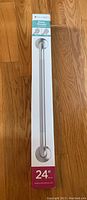 Photo of boxed 24-inch Easy Mount grab bar showing packaging and dimensions.