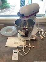 Overview of mixer, bowl, attachments, manual