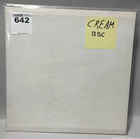Photo of the vinyl record sleeve showing signs of age and a handwritten label 'CREAM BBC' on yellow paper.