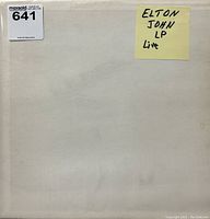White plain cover sleeve with handwritten sticky note labeled "Elton John LP Live" and MaxSold inventory sticker 641.