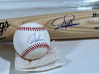 Close-up photo showing Dean Palmer autograph on the baseball and bat.