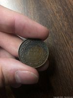 Reverse of the 1918 Canadian penny showing 'ONE CENT CANADA 1918' surrounded by a wreath.