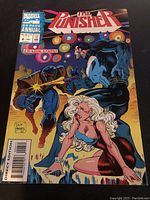 Marvel Comics The Punisher 64-page annual comic book cover featuring The Punisher and a female character, titled 'Eradication'.