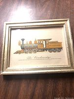 Front view of framed vintage train picture showing detailed illustration of "The Buckehaidge" train with a distressed white wooden frame.