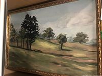 Full view of largest canvas print featuring landscape and ornate gold frame