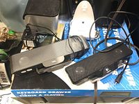 Photo showing two Logitech speakers and one Pioneer sound bar on top of a keyboard drawer box
